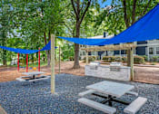 Thumbnail 23 of 27 - our apartments have a community picnic area with tables and chairs