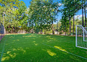 Thumbnail 24 of 27 - a soccer field with a goal in the middle of it