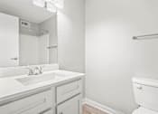 Thumbnail 19 of 27 - a bathroom with a sink toilet and mirror