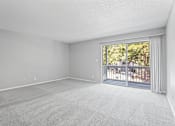 Thumbnail 16 of 27 - an empty bedroom with a sliding glass door and a balcony