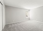 Thumbnail 17 of 27 - an empty bedroom with a window