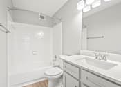 Thumbnail 18 of 27 - a bathroom with a sink toilet and bathtub