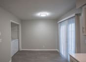 Thumbnail 30 of 32 - living room and laundry room of an apartment home