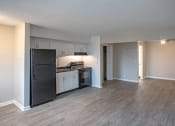 Thumbnail 25 of 32 - living room with a renovated kitchen with a stove and refrigerator