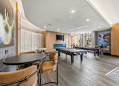 Thumbnail 57 of 57 - A modern dining room with a round table and chairs.
