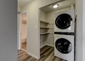 Thumbnail 6 of 11 - A white dryer is in a small laundry room.