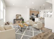 Thumbnail 50 of 57 - A modern living room with a coffee table in the center.