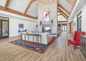 Thumbnail 18 of 43 - a living room with a fireplace and a rug