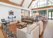 Thumbnail 16 of 43 - a large living room with couches and chairs and a large rug