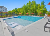 Thumbnail 38 of 43 - the reserve at city center spacious pool with chaise lounge chairs