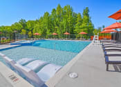Thumbnail 40 of 43 - the reserve at city center spacious pool with chairs and umbrellas