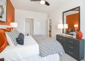 Thumbnail 11 of 43 - a bedroom with a large bed and a mirror