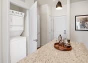 Thumbnail 6 of 43 - a kitchen with white appliances and a counter top