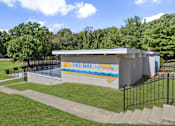Thumbnail 10 of 18 - A pool building with the words "This Way to the Pool" on it.