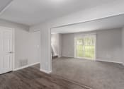 Thumbnail 19 of 29 - the living room and dining room of an apartment
