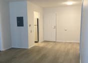 Thumbnail 6 of 25 - an empty room with a white door and white walls
