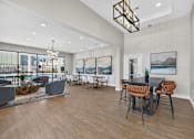 Thumbnail 2 of 23 - A modern dining room with a large table and chairs.