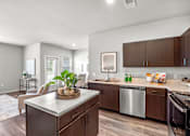 Thumbnail 40 of 41 - A kitchen with a stainless steel dishwasher and a sink.