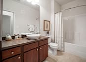 Thumbnail 28 of 38 - A bathroom with a white toilet and a white bathtub. at Aventura at Richmond, St. Peters, MO, 63376