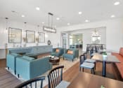 Thumbnail 18 of 28 - a living room filled with furniture and a large window at Aventura at Hawk Ridge, Lake St Louis, MO
