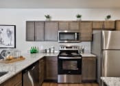 Thumbnail 5 of 28 - modern kitchen with stainless steel appliances  at Aventura at Hawk Ridge, Missouri