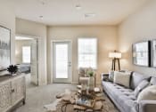 Thumbnail 11 of 28 - a living room with a couch and a coffee table at Aventura at Hawk Ridge, Lake St Louis, 63367