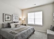 Thumbnail 13 of 28 - a bedroom with a bed and a window  at Aventura at Hawk Ridge, Lake St Louis, 63367