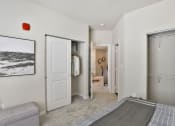 Thumbnail 14 of 28 - a bedroom with a bed and a closet  at Aventura at Hawk Ridge, Lake St Louis