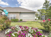 Thumbnail 17 of 31 - a house with flowers in front of it  at Aventura at Richmond, St. Peters, MO