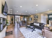 Thumbnail 20 of 31 - a living room filled with furniture and a flat screen tv at Aventura at Richmond, St. Peters