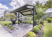 Thumbnail 30 of 31 - an outdoor patio with a picnic table and a gazebo  at Aventura at Richmond, Missouri, 63376