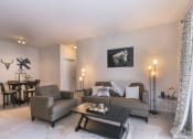 Thumbnail 10 of 31 - a living room with a couch and a chair and a table at Aventura at Richmond, St. Peters, MO, 63376