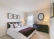 Thumbnail 14 of 31 - a bedroom with a bed and a dresser  at Aventura at Richmond, St. Peters, MO, 63376