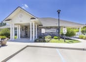 Thumbnail 37 of 37 - the front entrance of a white building with columns and a porch at Aventura at Towne Centre, Missouri, 63011