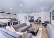 Thumbnail 3 of 37 - a living room with a couch and a table at Aventura at Towne Centre, Ellisville, MO