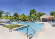 Thumbnail 14 of 37 - our resort style pool is filled with lounge chairs and a resort style spa at Aventura at Towne Centre, Ellisville