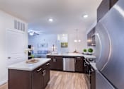 Thumbnail 28 of 37 - a kitchen with stainless steel appliances and a stainless steel refrigerator at Aventura at Towne Centre, Ellisville
