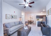 Thumbnail 23 of 37 - a living room with a couch and a tv at Aventura at Towne Centre, Missouri, 63011