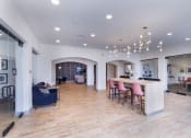 Thumbnail 5 of 29 - a living room with a kitchen and a dining room at Aventura at Wild Horse Creek, Chesterfield, Missouri