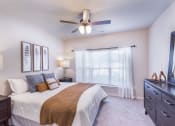 Thumbnail 25 of 29 - a bedroom with a large bed and a ceiling fan at Aventura at Wild Horse Creek, Chesterfield, 63017