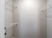 Thumbnail 35 of 41 - Empty white shelves in a room at Aventura at Wentzville I & II Apartments, Wentzville