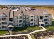 Thumbnail 1 of 28 - an aerial view of an apartment complex with a field in the background  at Aventura at Hawk Ridge, Lake St Louis, 63367