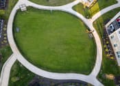 Thumbnail 36 of 37 - an aerial view of an oval lawn in a park at The Edison at Blue Springs, Blue Springs, MO, 64014
