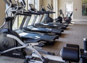 Thumbnail 8 of 37 - a row of cardio bikes in a gym at The Edison at Blue Springs, Blue Springs, MO