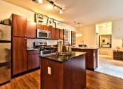 Thumbnail 3 of 22 - a kitchen with stainless steel appliances and an eat in counter top  at Aventura at Mid Rivers, St. Charles, 63304