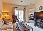 Thumbnail 6 of 22 - a living room with a couch and a tv  at Aventura at Mid Rivers, St. Charles, MO