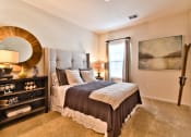 Thumbnail 10 of 22 - a bedroom with a large bed and a window  at Aventura at Mid Rivers, St. Charles, Missouri