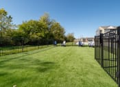 Thumbnail 28 of 28 - dog park with fence and chairs  at Aventura at Hawk Ridge, Lake St Louis, MO, 63367