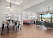 Thumbnail 3 of 36 - A modern dining room with a wooden table and chairs.