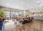 Thumbnail 24 of 41 - A modern living room with a kitchen area in the background at Aventura at Wentzville I & II Apartments, Wentzville, Missouri